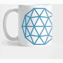 a white mug with a blue geometric pattern on it .