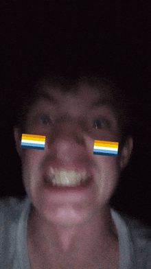 a close up of a man 's face with flags on his face