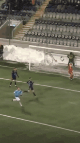 soccer players on a field with a sign that says r