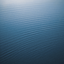 a close up of a blue water surface