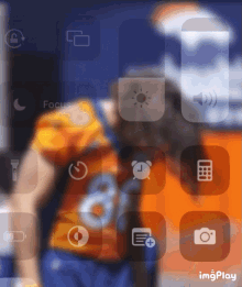 a blurred image of a phone screen with icons including a calculator and a flashlight