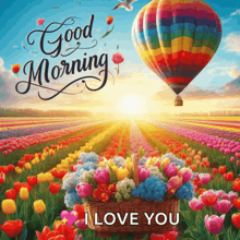a colorful hot air balloon is flying over a field of tulips