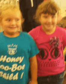 a girl wearing a blue shirt that says honey bo-bob cried