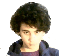 a young boy with curly hair is wearing a blue jacket