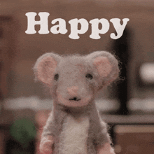 a picture of a stuffed animal with the word happy above it