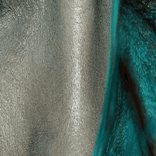 a close up of a person 's face with silver paint on it .