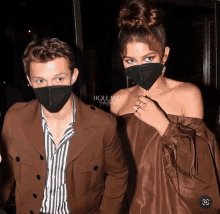 a man and a woman wearing face masks are standing next to each other and the caption says holland journeys