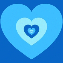 a blue heart with three smaller hearts inside of it .