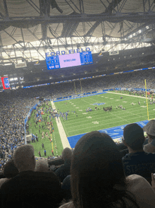 a football game is being played in a stadium that says ford field