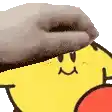 a close up of a person 's hand on top of a yellow cartoon character with a smiley face .