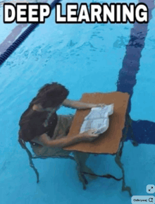 a person is sitting at a desk in a pool with the words deep learning written above them