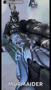 a person in a skeleton costume is sitting on a couch with a mermaid tail .