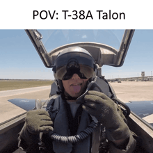 a man sticking his tongue out while sitting in a cockpit with the caption pov t-38a talon