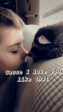 a young boy kisses a cat on the nose with the words " cause i love you like that "