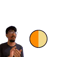 a man with glasses is clapping in front of a sign that says splodey + drilly splodedrilly