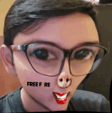 a man wearing glasses has a pig nose and the word free fire written on his face