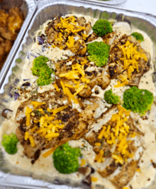 a casserole dish filled with chicken broccoli and cheese