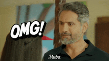 a man with a beard says omg in front of him