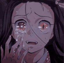 a girl with red eyes is crying with tears coming out of her eyes