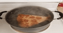 a slice of pepperoni pizza is being cooked in a pot of water