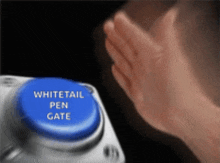 a blue button that says whitetail pen gate on it