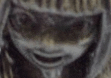 a close up of a person 's face wearing sunglasses and a mask .