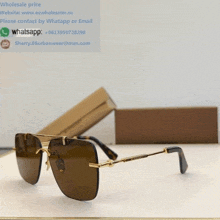 a pair of sunglasses sitting on a table next to a box that says wholesale price