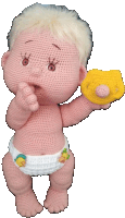 a crocheted baby in a diaper holds a pacifier