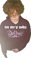 a person wearing a purple detroit sweatshirt with a white background