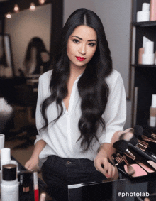 a woman in a white shirt is standing in front of a makeup counter