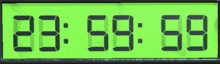 a green digital clock displays the time as 20:56