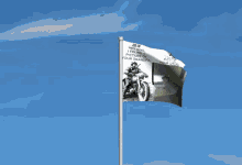 a flag with a picture of a man on a motorcycle and the year 2019