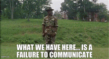 a man in a military uniform is standing in a grassy field with the words what we have here is a failure