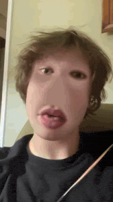 a close up of a person 's face with a very large mouth