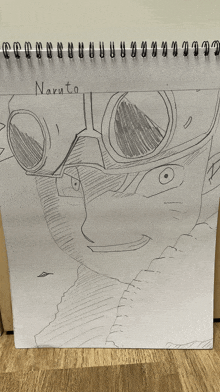 a drawing of naruto is on a spiral bound piece of paper