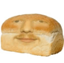 a loaf of bread with a face on it that looks like a man 's face .