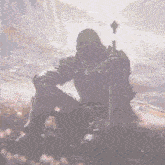 a knight in armor is kneeling down with a sword in his hand