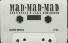 a white cassette tape that says mad mad mad mastertronic added dimension manic miner spec