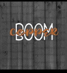 the word boom is on a wooden surface