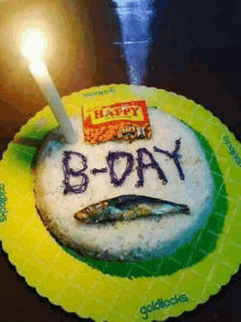 a b-day cake with a candle and a bag of happy