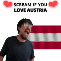 a man with glasses is screaming in front of a flag with the words " scream if you love austria "