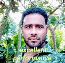 a man with a beard is taking a selfie in front of trees with the words `` excellent performance '' .