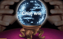 a crystal ball with the words chuj wie written on it