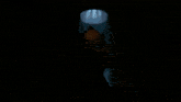 a close up of a clown 's face in the dark