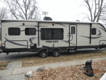 a white trailer with the word premier on the side of it