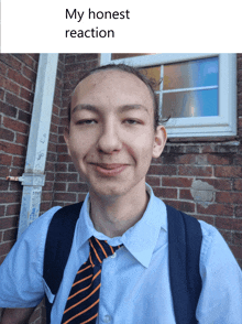 a young man in a school uniform is smiling with the caption " my honest reaction "