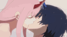 a girl with pink hair kisses a boy with black hair