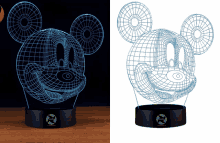 a glow in the dark mickey mouse lamp on a table