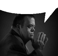 a man with down syndrome has his hands folded in prayer