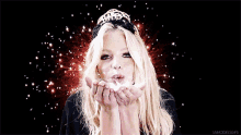 a woman wearing a tiara blowing a kiss with the words vsmodelsgifs below her